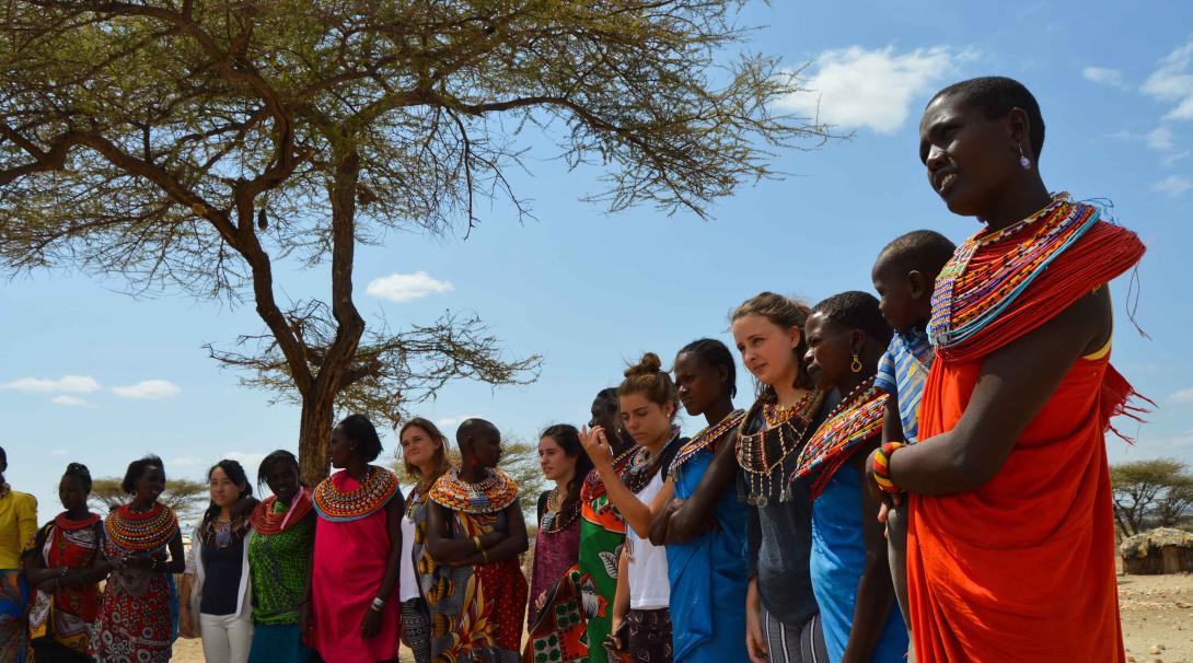 Volunteers visit a traditional village in Kenya during their volunteer trip abroad