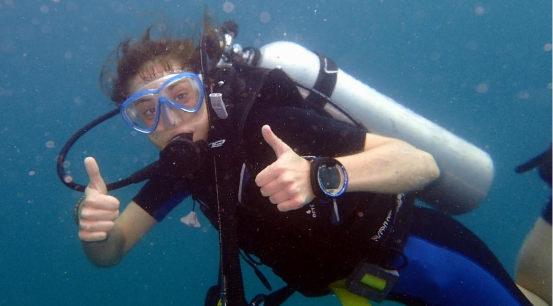 Volunteer gives a thumbs up during her Conservation Project abroad