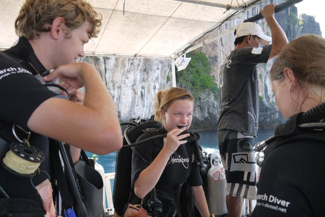 Volunteers preparing for a dive during the conservation project