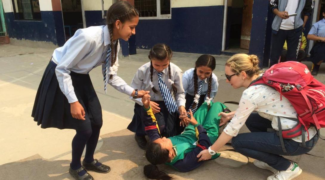 Volunteers at Projects Abroad international medical internships in Nepal teach children first aid.