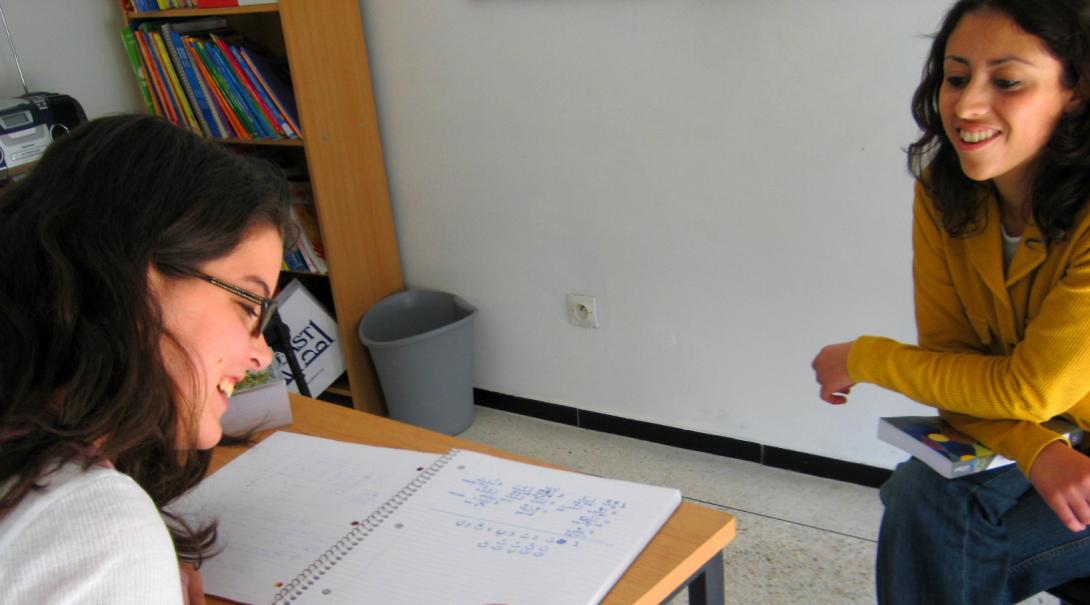As part of her cultural exchange program abroad, a volunteer learns a new language.