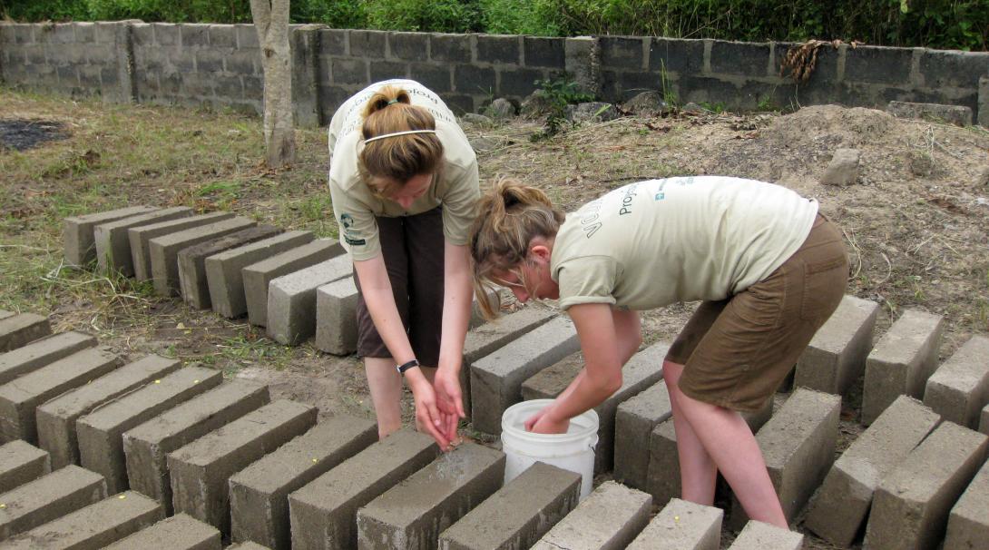 An important part of building volunteer work in Ghana is to prepare building materials.