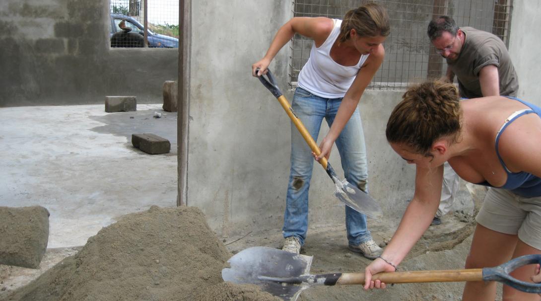 Construction volunteers in Ghana building classrooms.