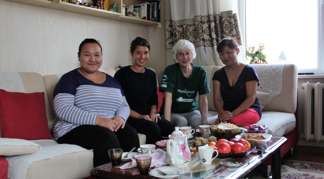Retired volunteer with her host family in Mongolia