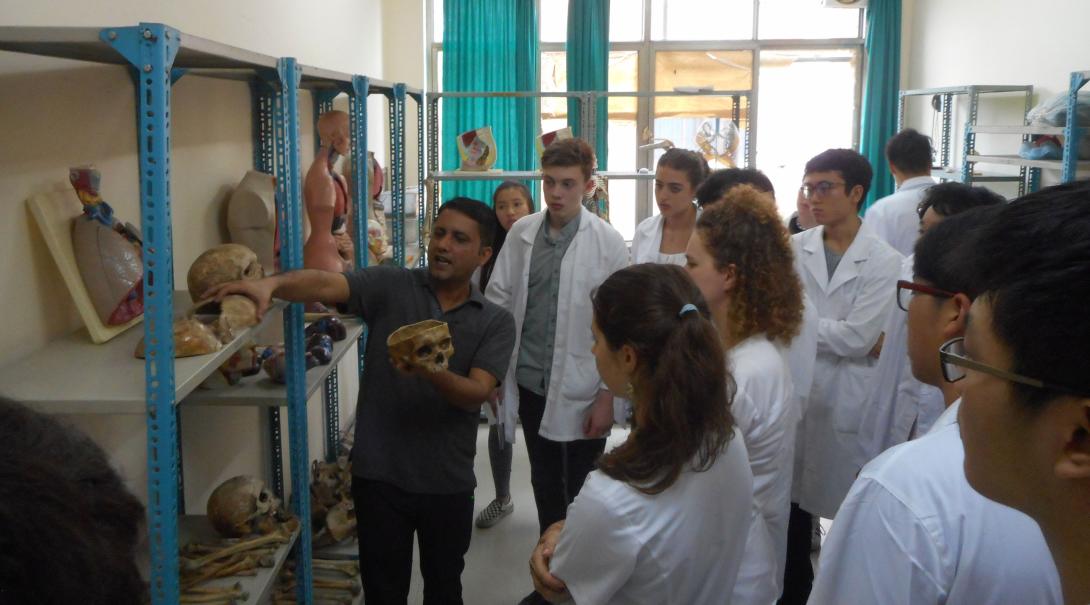 High School Special Medicine volunteers receive an anatomy lesson from a teacher at the Chitwan Medical College
