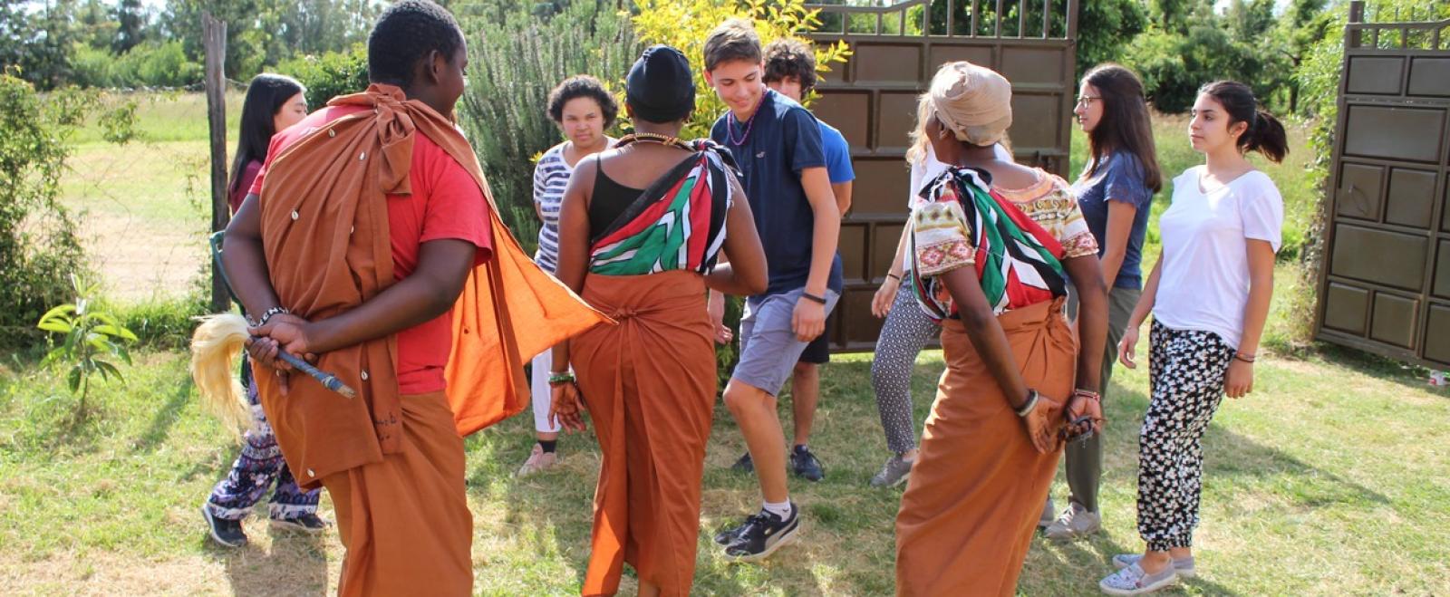 High school students volunteering in Kenya learn some local dance moves