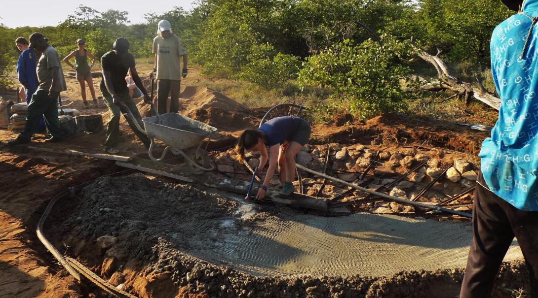 Projects Abroad Bushveld Conservation volunteers work hard to build a waterhole at the Wild at Tuli game reserve in Botswana