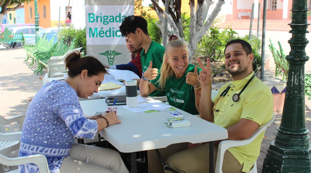 Medical volunteers treat locals at a mobile clinic in Mexico.