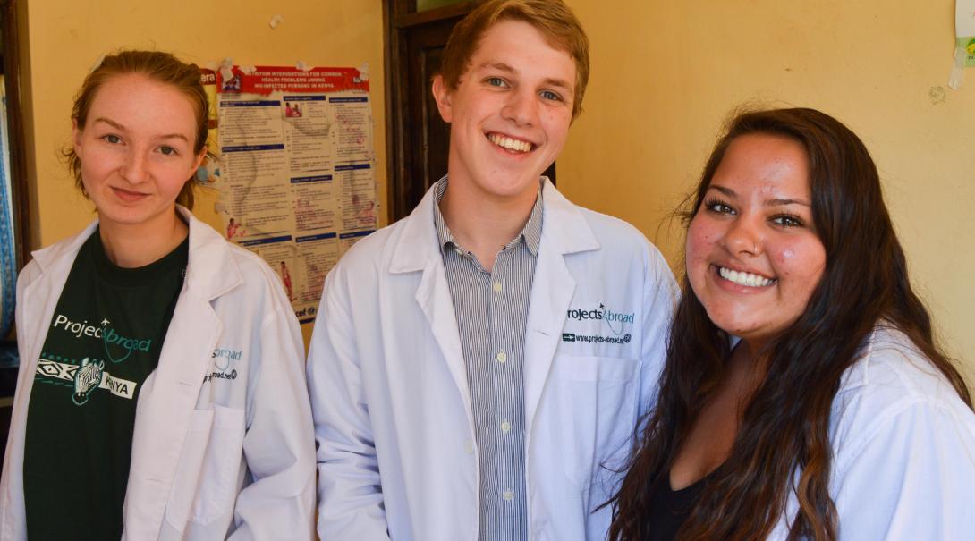 A group of high school students doing a medicine internship take a break between shifts at a clinic in Kenya.  