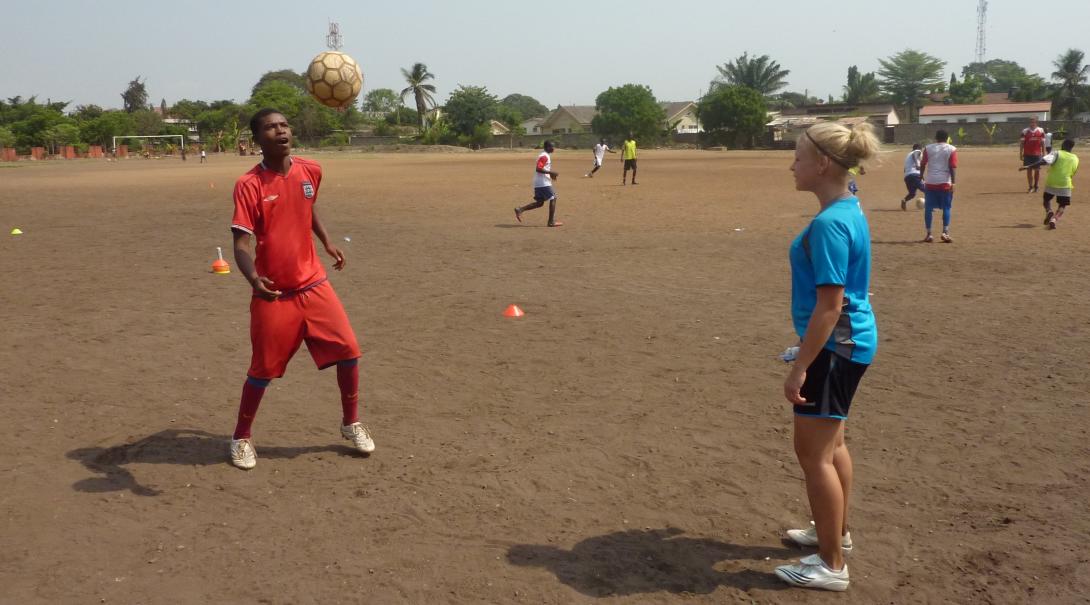 Projects Abroad High School volunteer practices football techniques in Ghana during her Football Coaching project.