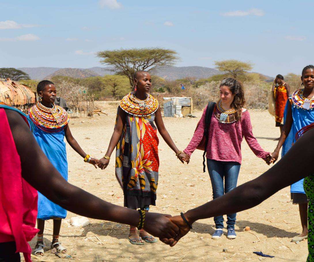 Projects Abroad volunteers learning a traditional dance to welcome them to the Samburu village during their gap year in Kenya.