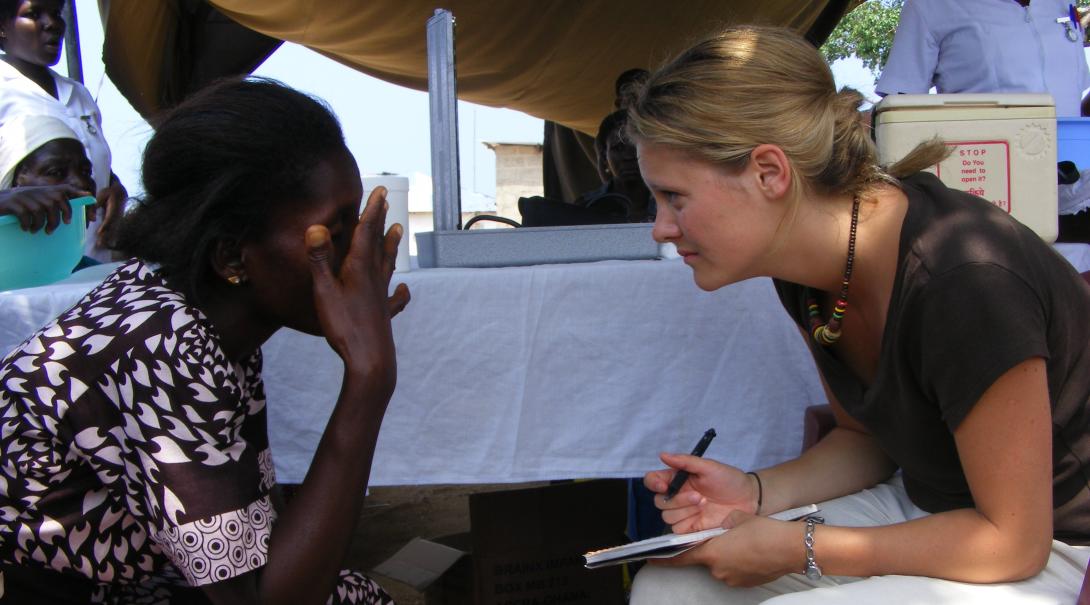 A Projects Abroad volunteer listens to a patient in Ghana during her dentistry internship.