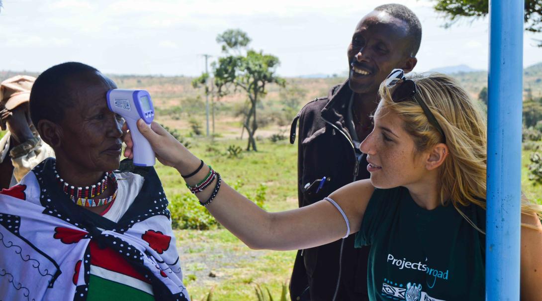 A Projects Abroad medical volunteer helps doctors and nurses with different medical tasks during a medical outreach in Kenya.