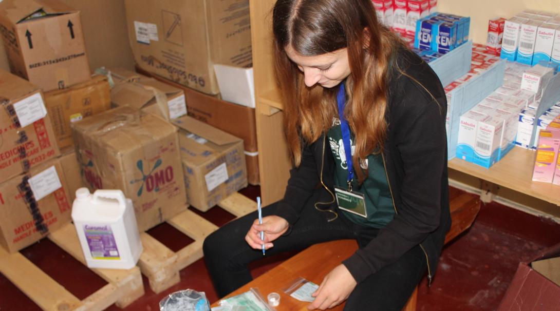 Projects Abroad volunteer classifies medicines in a hospital in Ghana during her pharmacy internship.