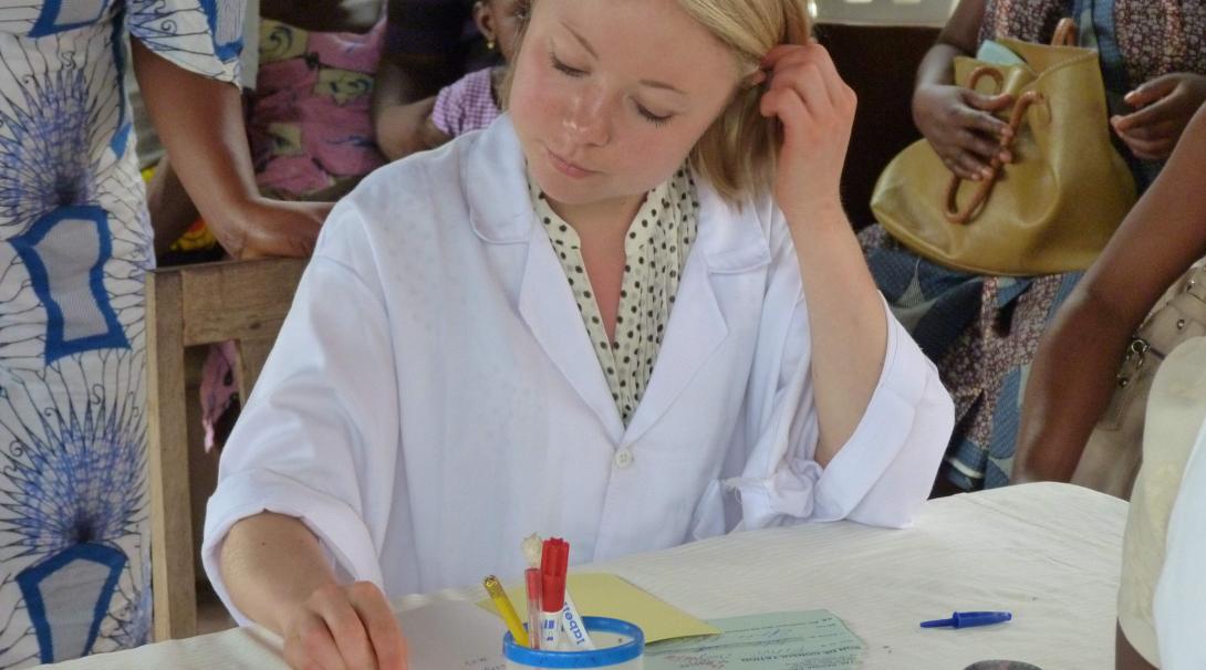 A volunteer doing a pharmacy internship with Projects Abroad in Ghana verifies a medical prescription.