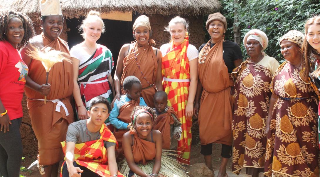 A group of teenage volunteers doing a care internship in Kenya with Projects Abroad experience local culture.