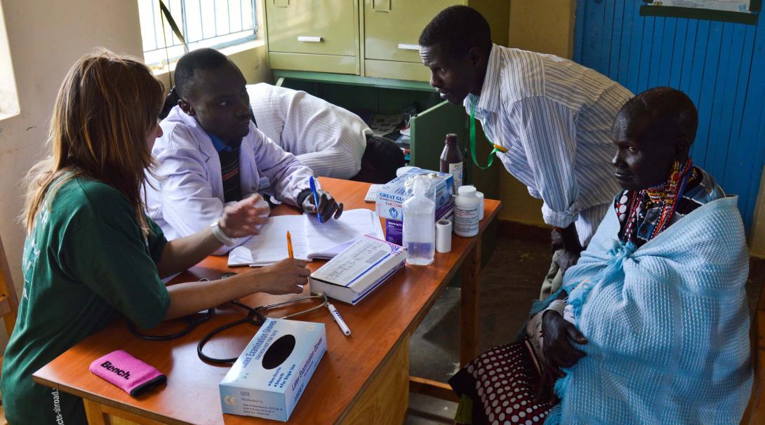 A Projects Abroad medical volunteer shadows a doctor during a medical consultation in Kenya.