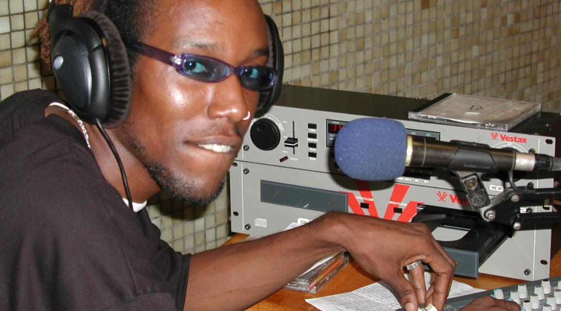 A radio journalist in Ghana