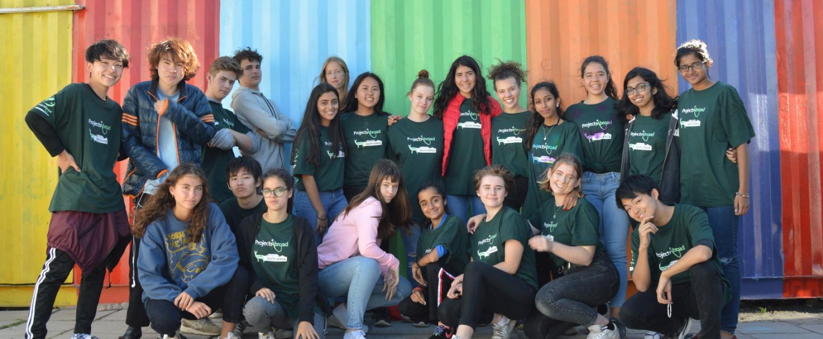 A group of teenagers from the same school on a group volunteer trip to South Africa.