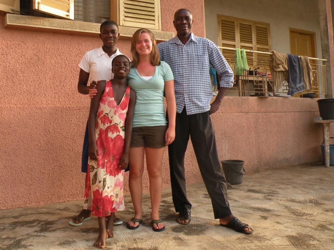 A care volunteer with her Ghanaian host family