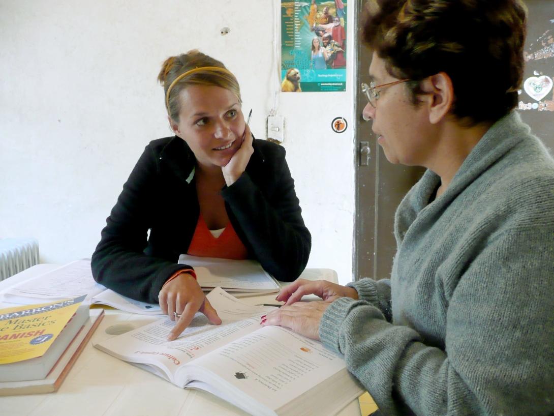 A volunteer on a Spanish language course in Mexico attends a lesson with her tutor.