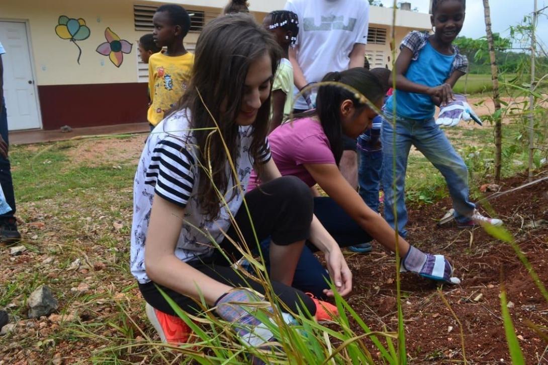 Volunteers maintaining garden in a school in Jamaica