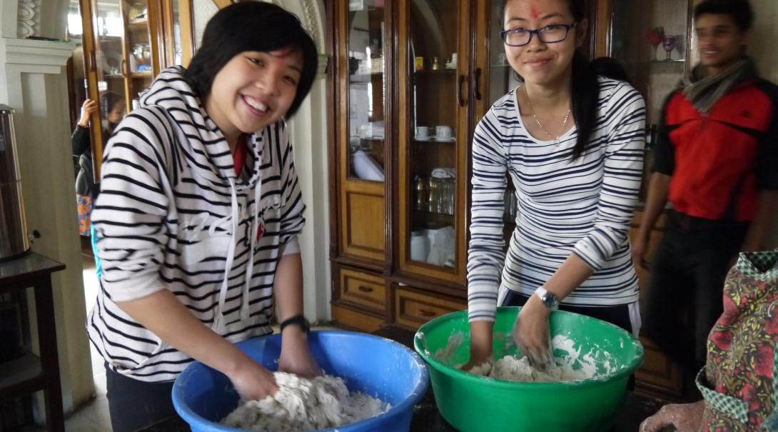 Projects Abroad volunteers in Nepal learning to make some traditional momo